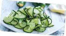 Fresh made Cucumber Salad in a bowl (close-up shot)